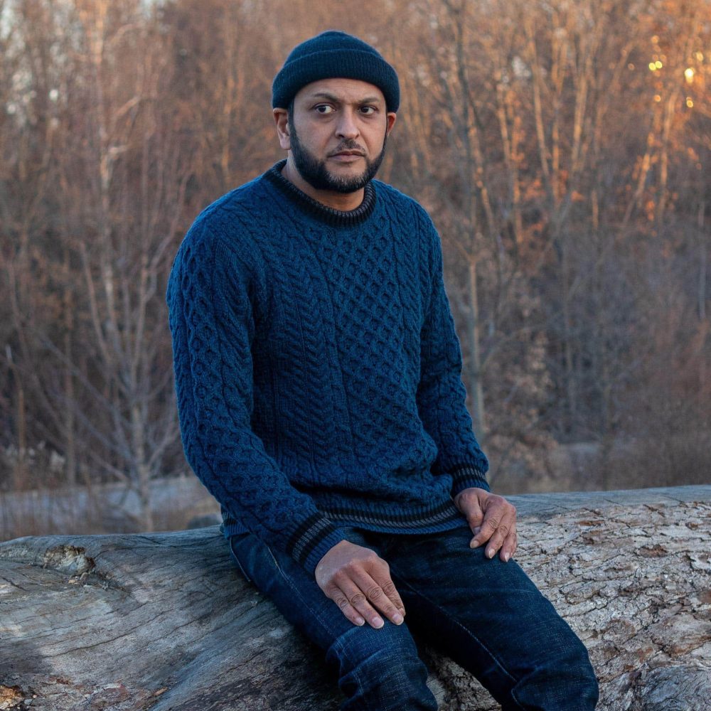 Striped Aran Teal Sweater by Aran Woollen Mills. Sitting view #1.