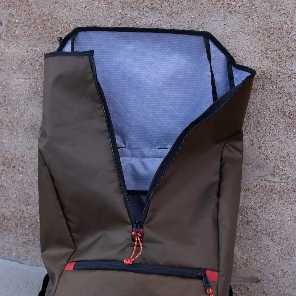 Commuter Center-zip Backpack in Olive by Flowfold. Unzipped Top View.