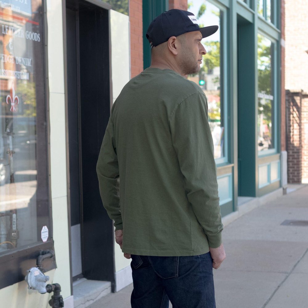 Seeker Long Sleeve Pocket Crewneck in olive. Back view.