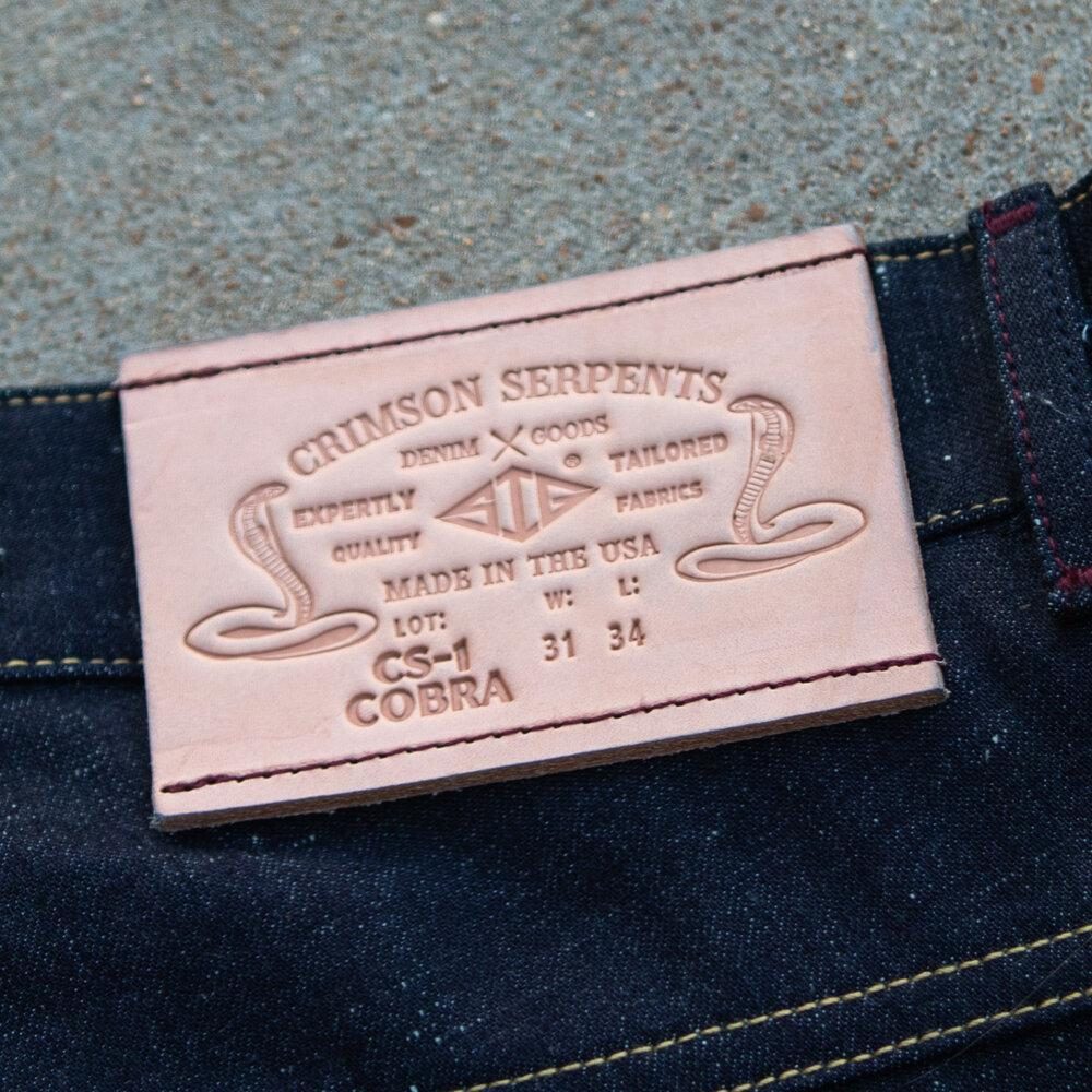 Cobra Nep Selvedge Slim Straight by Crimson Serpents Denim Goods. Leather patch view.