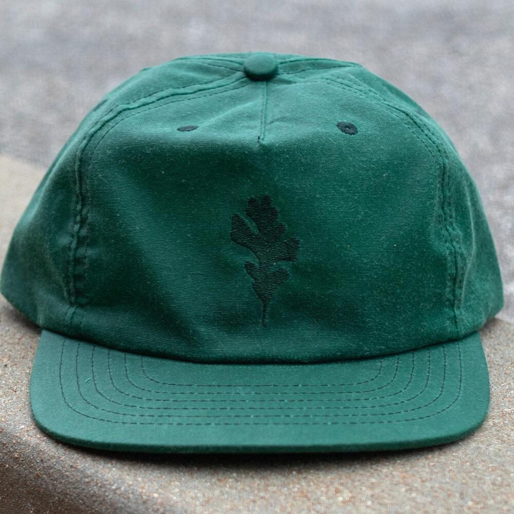 Leaf Wax Canvas Cap in Green by Ginew. Genesis leaf embroidery view.