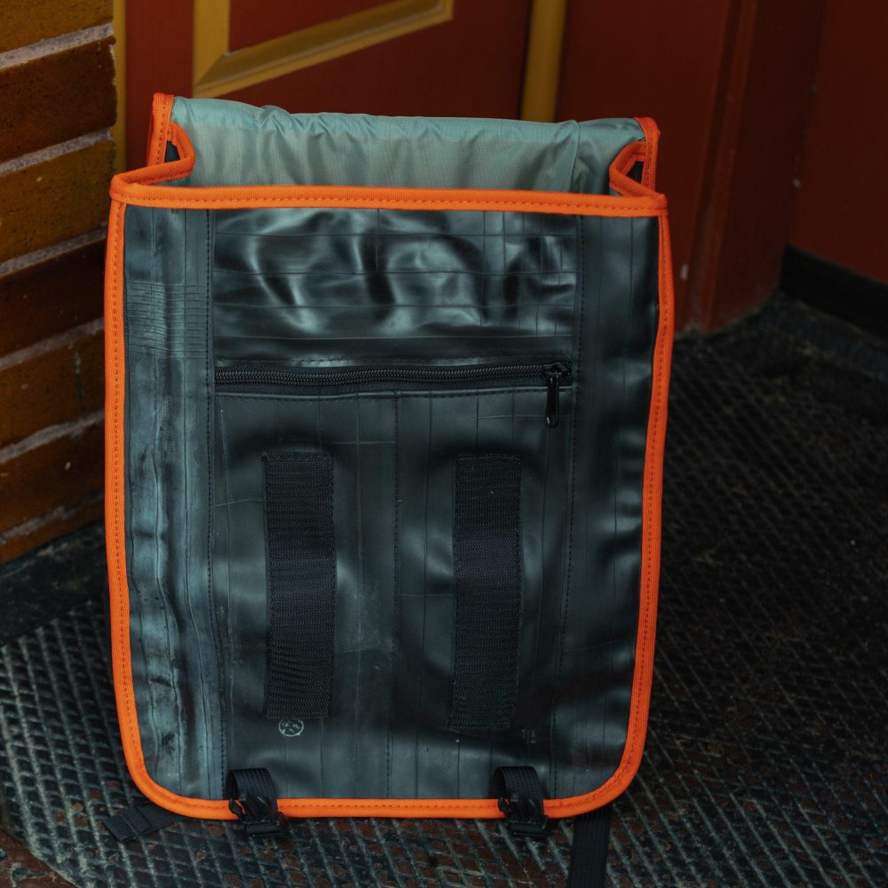 Madison Upcycled Backpack by Alchemy Goods. Black and mandarin inside view.