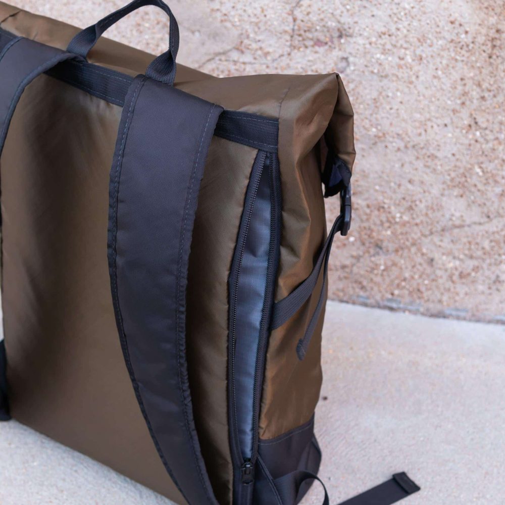 Commuter Center-zip Backpack in Olive by Flowfold. Side Laptop Compartment View #2.