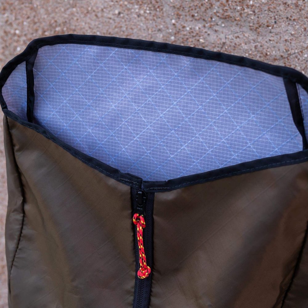 Commuter Center-zip Backpack in Olive by Flowfold. Open Top View.