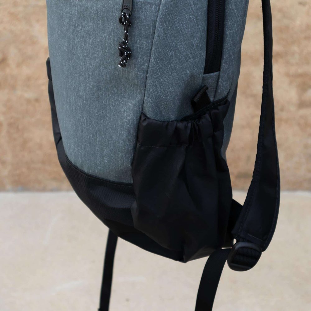 Gray Large Optimist Backpack 18L Flowfold. Elastic side bag view.