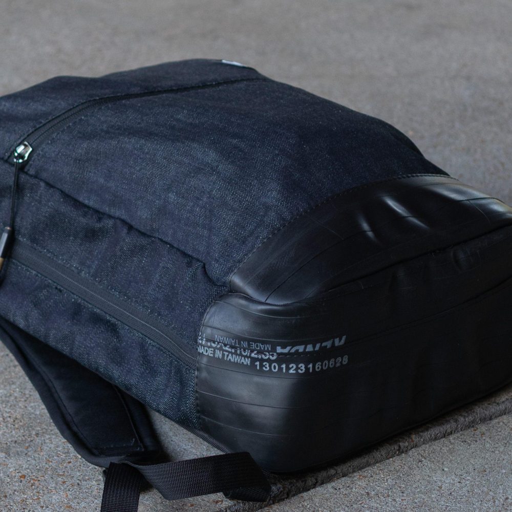 Fremont Recycled Denim Backpack by Alchemy Goods. Upcylced bicycle tube bottom view.